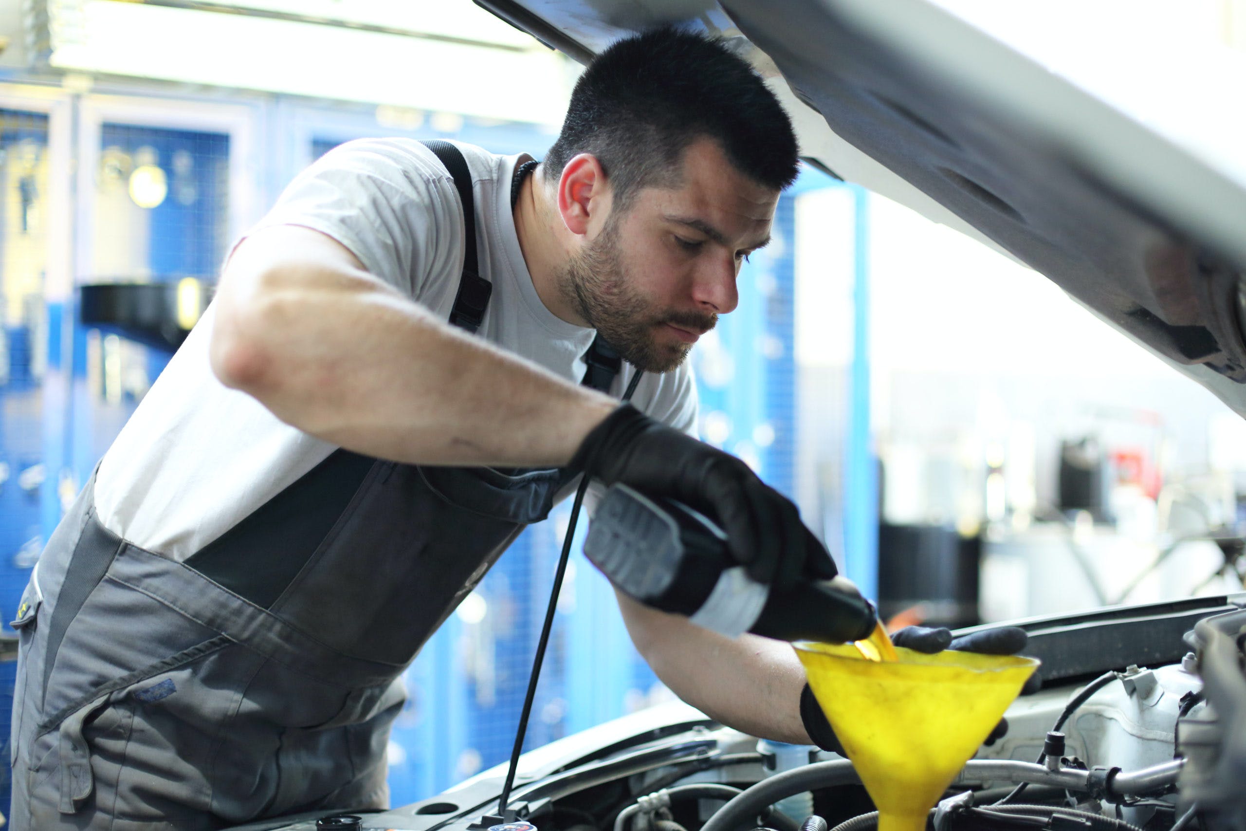 mechanic-performing-an-oil-change-scaled-1.jpg